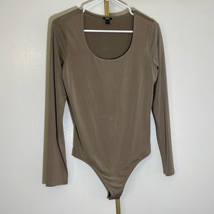 Express long sleeve bodysuit in greyish tan color size medium